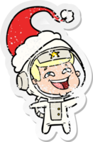 hand drawn distressed sticker cartoon of a laughing astronaut wearing santa hat png
