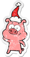 happy hand drawn distressed sticker cartoon of a pig wearing santa hat png