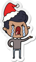 main tiré autocollant dessin animé de une pleurs homme portant Père Noël chapeau png