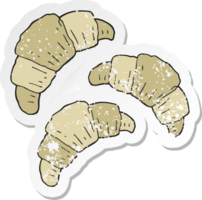 retro distressed sticker of a cartoon croissants png