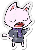 distressed sticker of a talking cat wearing winter clothes png