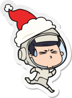 hand drawn sticker cartoon of a stressed astronaut wearing santa hat png