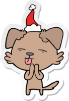 hand drawn sticker cartoon of a dog sticking out tongue wearing santa hat png