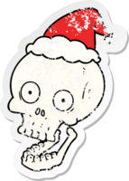 hand drawn distressed sticker cartoon of a skull wearing santa hat png