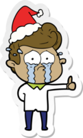 hand drawn sticker cartoon of a crying man wearing santa hat png