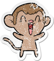 distressed sticker of a cartoon laughing monkey png