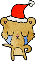 llorando mano dibujado texturizado dibujos animados de un oso vistiendo Papa Noel sombrero png