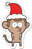 main tiré autocollant dessin animé de une huées singe portant Père Noël chapeau png