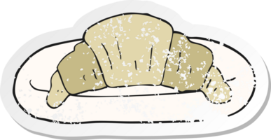 retro distressed sticker of a cartoon croissant png