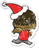 hand- getrokken verontrust sticker tekenfilm van een jongen met slordig haar- vervelend de kerstman hoed png