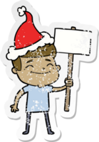 happy hand drawn distressed sticker cartoon of a man with placard wearing santa hat png