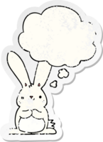 cartoon rabbit with thought bubble as a distressed worn sticker png