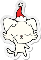 mignonne main tiré autocollant dessin animé de une chien portant Père Noël chapeau png