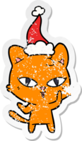 mão desenhado angustiado adesivo desenho animado do uma gato vestindo santa chapéu png