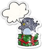 cartoon penguin on wrapped present with speech bubble distressed distressed old sticker png