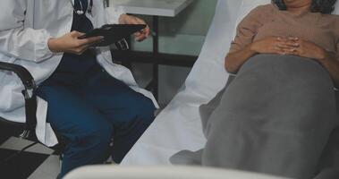 Cropped shot of a female nurse hold her senior patient's hand. Giving Support. Doctor helping old patient with Alzheimer's disease. Female carer holding hands of senior man photo