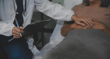 Cropped shot of a female nurse hold her senior patient's hand. Giving Support. Doctor helping old patient with Alzheimer's disease. Female carer holding hands of senior man photo