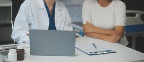 Doctor using sphygmomanometer with stethoscope checking blood pressure to a patient in the hospital. photo