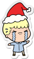 hand drawn sticker cartoon of a man crying wearing santa hat png