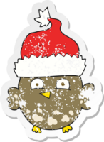 retro distressed sticker of a cartoon owl wearing christmas hat png