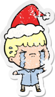 hand drawn distressed sticker cartoon of a man crying wearing santa hat png