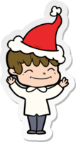 hand- getrokken sticker tekenfilm van een gelukkig jongen vervelend de kerstman hoed png