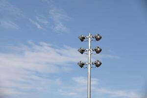 Street light with white cloud on blue sky background photo