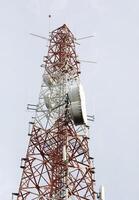 Telecommunication tower with clear sky background. photo