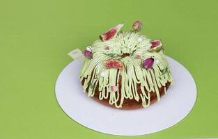 Large upcake decorated with light cream and dried fig fruit. photo