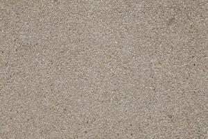 Beige colored Terrazzo seamless wall. Gravel floor texture and background photo