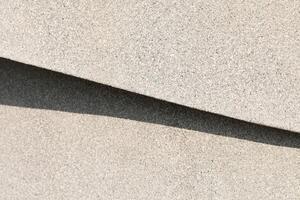 Abstract background from shadow on gravel wall. photo
