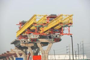 Machinery for placing precast segments over columns for the deck of elevated road. photo