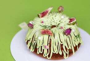 Large upcake decorated with light cream and dried fig fruit. photo