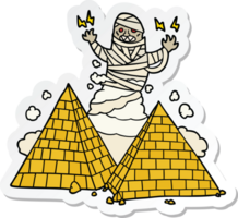 sticker of a cartoon mummy and pyramids png