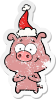 happy hand drawn distressed sticker cartoon of a pig wearing santa hat png