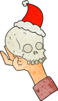 hand drawn textured cartoon of a hand holding skull wearing santa hat png