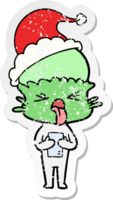 disgusted hand drawn distressed sticker cartoon of a alien wearing santa hat png