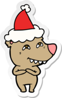 mano disegnato etichetta cartone animato di un' orso mostrando denti indossare Santa cappello png