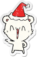 laughing polar bear hand drawn distressed sticker cartoon of a wearing santa hat png
