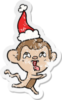 crazy hand drawn distressed sticker cartoon of a monkey running wearing santa hat png