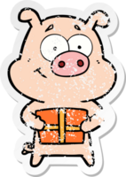 distressed sticker of a happy cartoon pig holding christmas present png