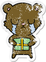 autocollant en détresse d'un ours en dessin animé qui pleure avec un cadeau png