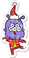 happy hand drawn distressed sticker cartoon of a alien dancing wearing santa hat png