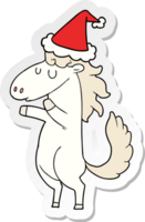 main tiré autocollant dessin animé de une cheval portant Père Noël chapeau png