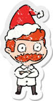 hand drawn distressed sticker cartoon of a man with mustache shocked wearing santa hat png