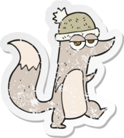 retro distressed sticker of a cartoon little wolf wearing hat png