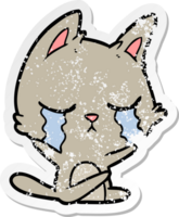 distressed sticker of a crying cartoon cat png