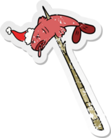 hand drawn distressed sticker cartoon of a fish speared wearing santa hat png