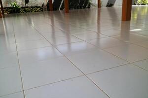 the floor of a building is made of clean white ceramic photo