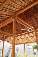 The roof of a simple building, the frame is made of wood. Roof tiles are made from clay photo
